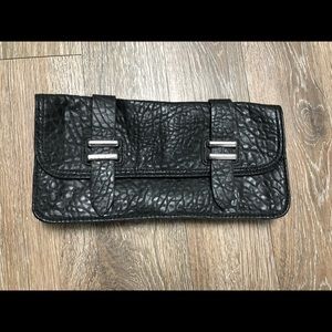 BCBGeneration black “leather” clutch